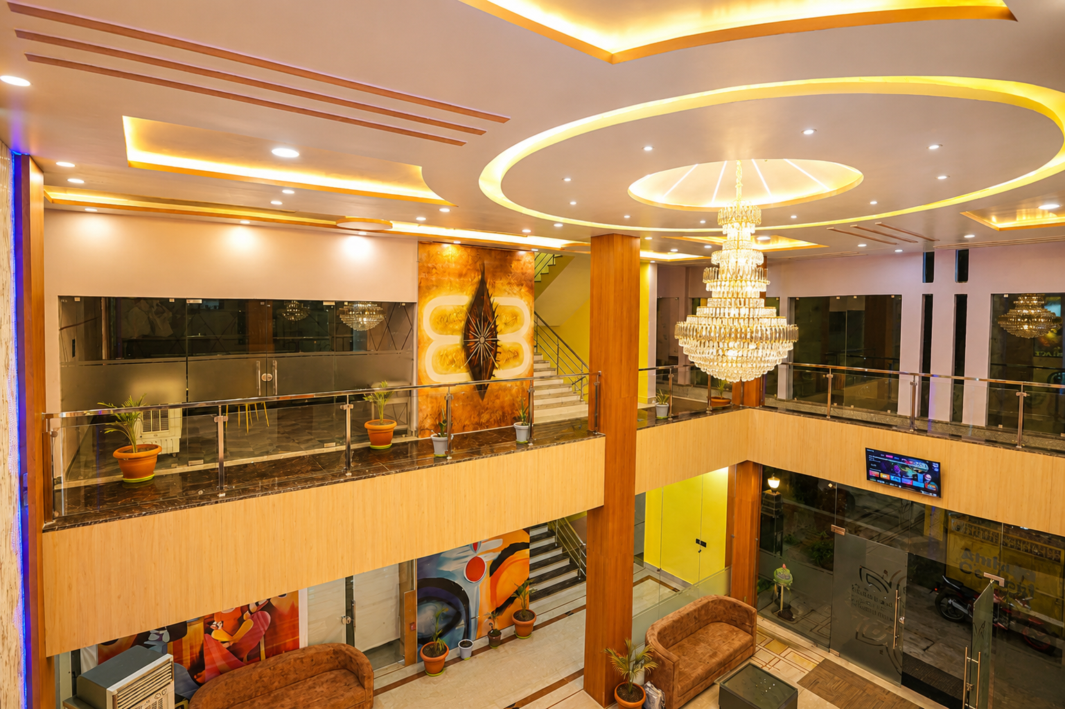 Grand double-height lobby atrium with crystal chandelier at Asha Palace