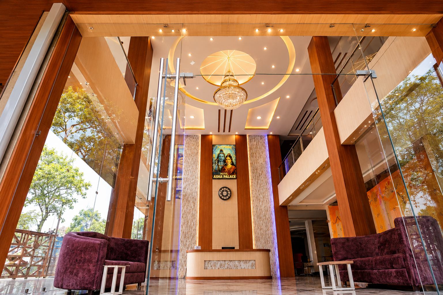 Asha Palace entrance and reception desk beneath the lobby chandelier