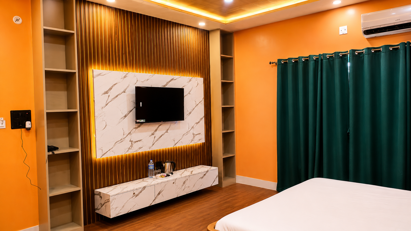 Suite Room TV and entertainment wall at Asha Palace