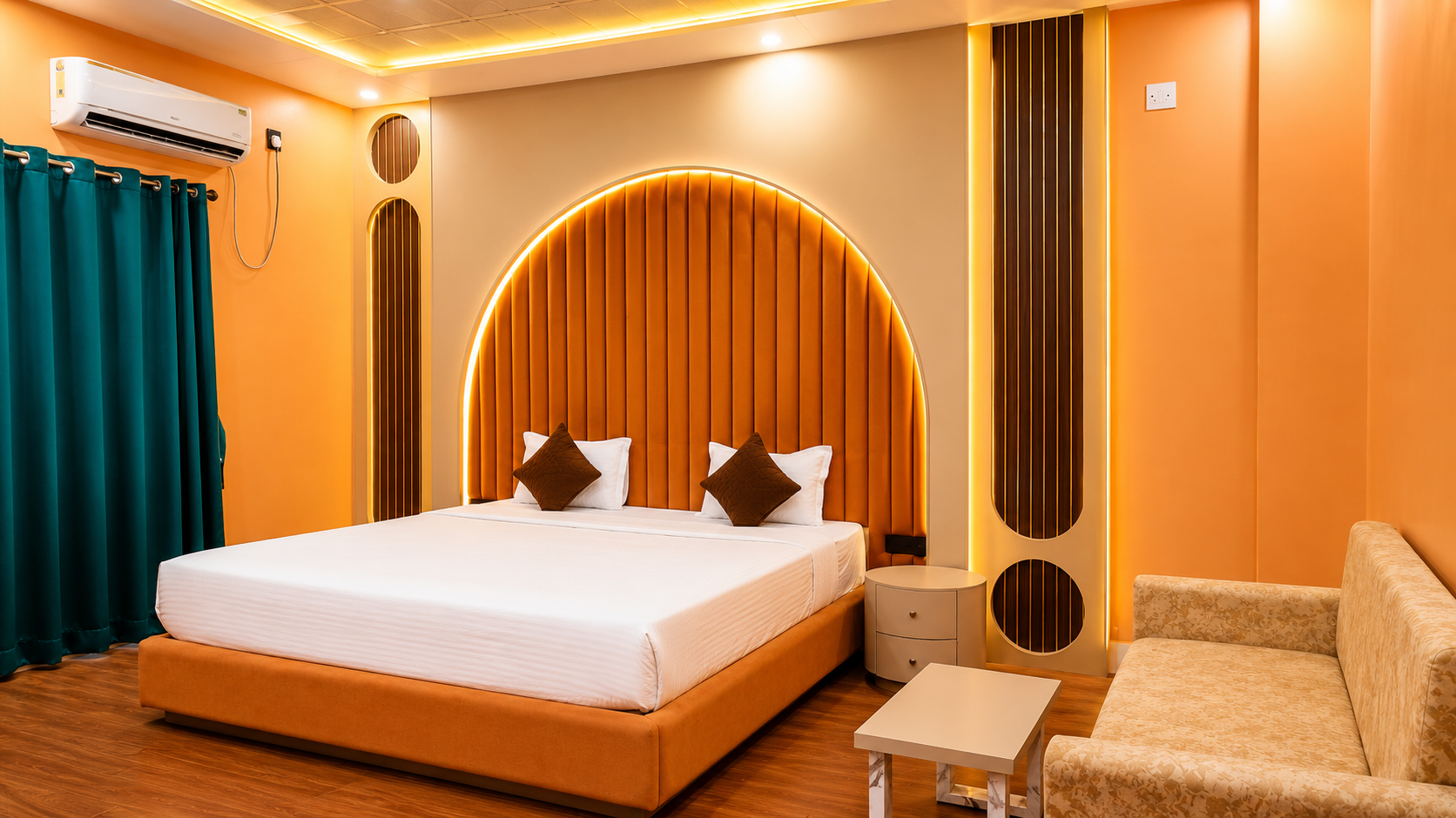 Suite Room bed and lounge seating at Asha Palace